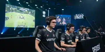Esports team competing with sponsor logos visible on jerseys and arena screens.